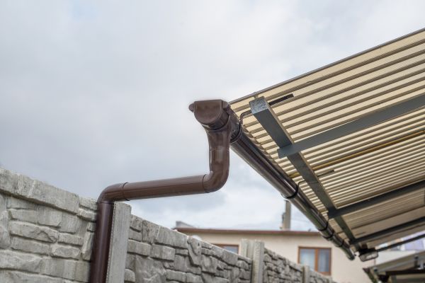 Plastic Downspout Installation in Longview